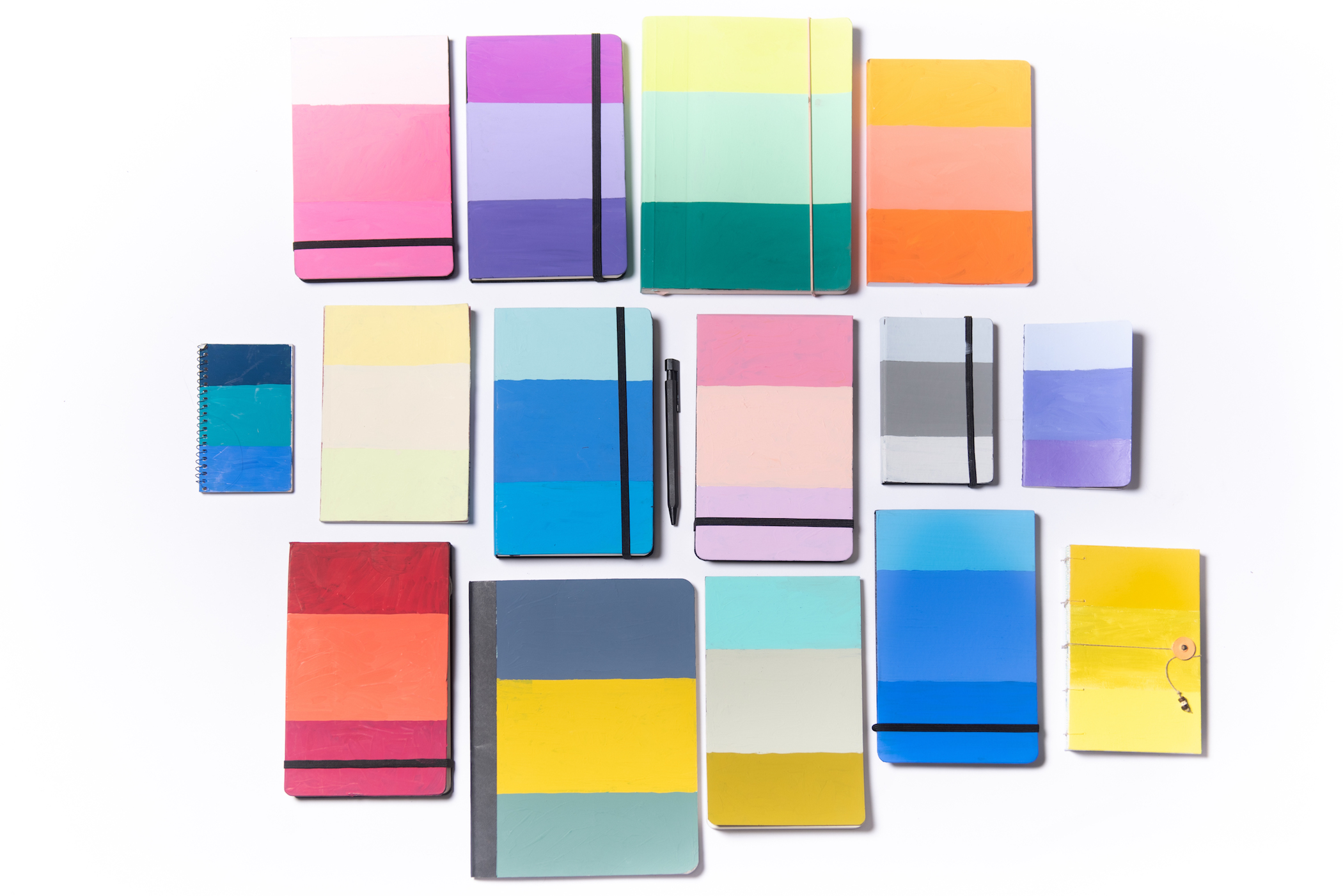 A collection of notebooks with colorful covers